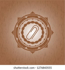 paper clip icon inside retro wooden emblem