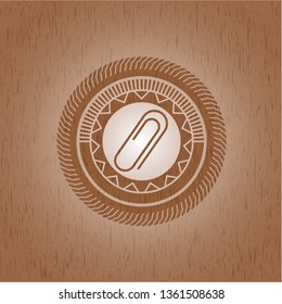 paper clip icon inside retro wooden emblem