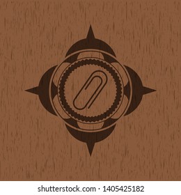 paper clip icon inside retro style wooden emblem