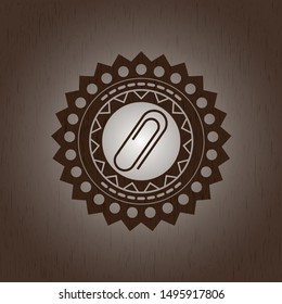 paper clip icon inside retro style wooden emblem