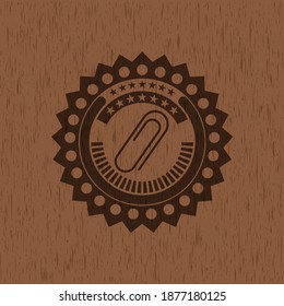 paper clip icon inside retro style wood emblem. 