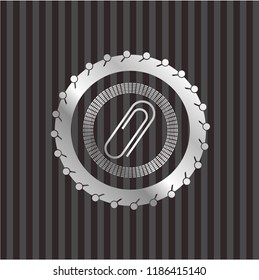 paper clip icon inside silver emblem