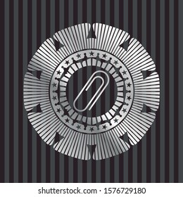 paper clip icon inside silver emblem