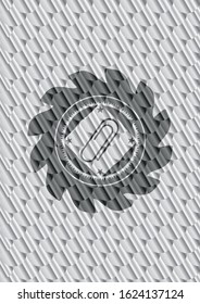 paper clip icon inside silver emblem or badge. Scales pattern. Vector Illustration. Detailed.