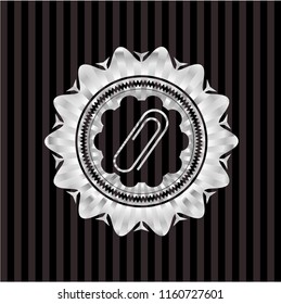 paper clip icon inside silvery emblem or badge