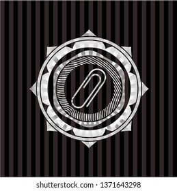 paper clip icon inside silvery emblem