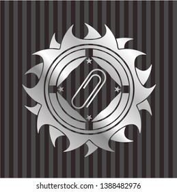 paper clip icon inside silvery badge or emblem