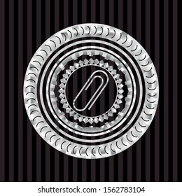 paper clip icon inside silvery emblem or badge