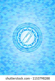 paper clip icon inside sky blue emblem. Mosaic background