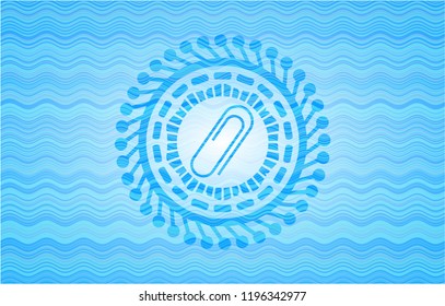 paper clip icon inside water wave badge background.