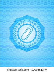 paper clip icon inside water wave concept style emblem.