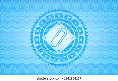 paper clip icon inside water wave concept style emblem.