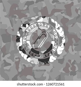 paper clip icon on grey camo pattern
