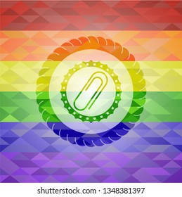 paper clip icon on mosaic background with the colors of the LGBT flag