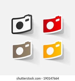 Paper clipped sticker: Digital compact photo camera. Isolated illustration icon