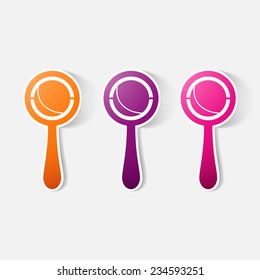 Paper clipped sticker: rattle. Isolated illustration icon