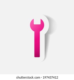 Paper clipped sticker: wrench. Isolated illustration icon