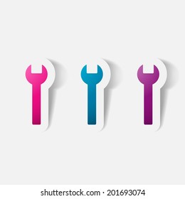 Paper clipped sticker: wrench. Isolated illustration icon