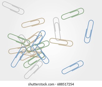 Paper clips scattered on a light background