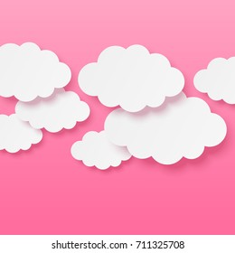 Paper clouds on pink background