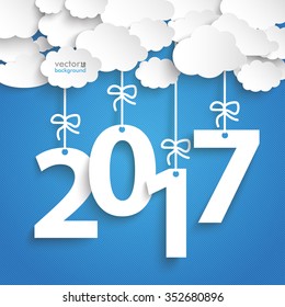 Paper clouds with text 2017 on the blue background. Eps 10 vector file.