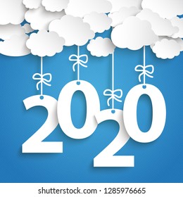 Paper clouds with text 2020 on the blue background. Eps 10 vector file.