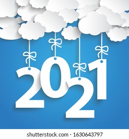 Paper clouds with text 2021 on the blue background. Eps 10 vector file.