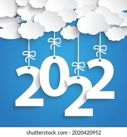 Nubes de papel con el texto 2022 sobre el fondo azul. Archivo vectorial Eps 10.