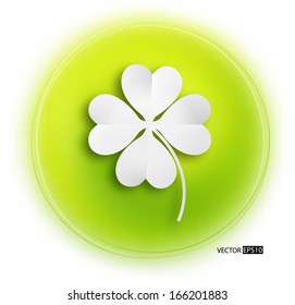 Paper clover leaf on green background.