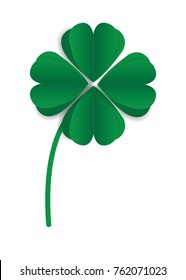 Paper clover leaf on green background.