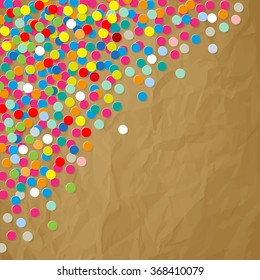 Paper colorful Confetti in the Corner on a crumpled paper brown Background.