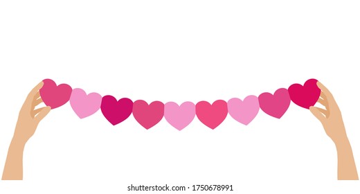 A paper crafted as heart shape held in somebody’s hands. Concept about love, care, concerned, sharing or hopefully.