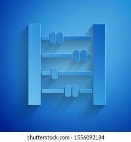 Paper cut Abacus icon isolated on blue background. Traditional counting frame. Education sign. Mathematics school. Paper art style. Vector Illustration