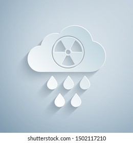 Paper cut Acid rain and radioactive cloud icon isolated on grey background. Effects of toxic air pollution on the environment. Paper art style. Vector Illustration