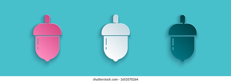 Paper cut Acorn icon isolated on blue background. Paper art style. Vector Illustration