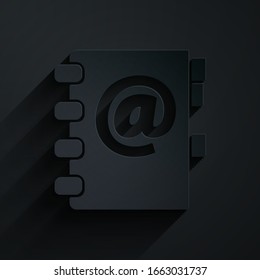 Paper cut Address book icon isolated on black background. Notebook, address, contact, directory, phone, telephone book icon. Paper art style. Vector Illustration