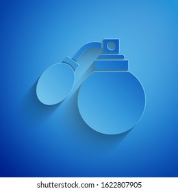 Paper cut Aftershave bottle with atomizer icon isolated on blue background. Cologne spray icon. Male perfume bottle. Paper art style. Vector Illustration