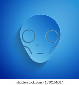 Paper cut Alien icon isolated on blue background. Extraterrestrial alien face or head symbol. Paper art style. Vector Illustration