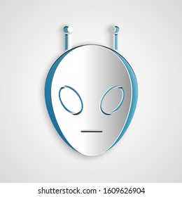 Paper cut Alien icon isolated on grey background. Extraterrestrial alien face or head symbol. Paper art style. Vector Illustration