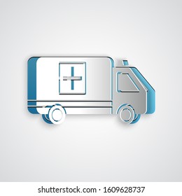 Paper cut Ambulance and emergency car icon isolated on grey background. Ambulance vehicle medical evacuation. Paper art style. Vector Illustration