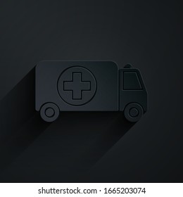 Paper cut Ambulance and emergency car icon isolated on black background. Ambulance vehicle medical evacuation. Paper art style. Vector Illustration
