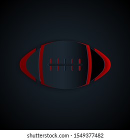 Paper cut American Football ball icon isolated on black background. Paper art style. Vector Illustration