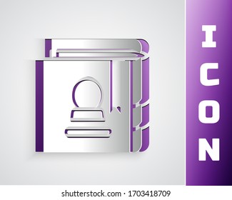 Paper cut Ancient magic book with alchemy recipes and mystic spells and enchantments icon isolated on grey background. Paper art style. Vector Illustration
