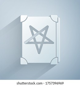 Paper cut Ancient magic book with alchemy recipes and mystic spells and enchantments icon isolated on grey background. Paper art style. Vector Illustration