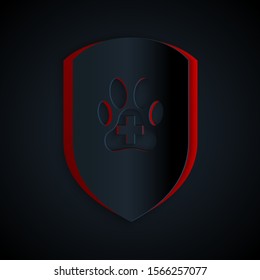 Paper cut Animal health insurance icon isolated on black background. Pet protection icon. Dog or cat paw print. Paper art style. Vector Illustration