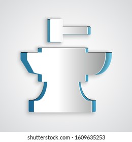 Paper cut Anvil for blacksmithing and hammer icon isolated on grey background. Metal forging. Forge tool. Paper art style. Vector Illustration