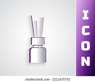 Paper cut Aroma diffuser icon isolated on grey background. Glass jar different with wooden aroma sticks. Paper art style. Vector