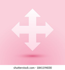 Paper cut Arrows in four directions icon isolated on pink background. Paper art style. Vector.