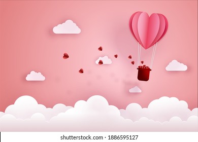 Paper cut art and digital craft style of love and valentine concept. Origami of hot air balloon flying over sky and cloud with floating hearts.