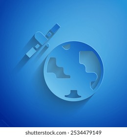 Paper cut Artificial satellites orbiting the planet Earth in outer space icon isolated on blue background. Communication, navigation concept. Paper art style. Vector